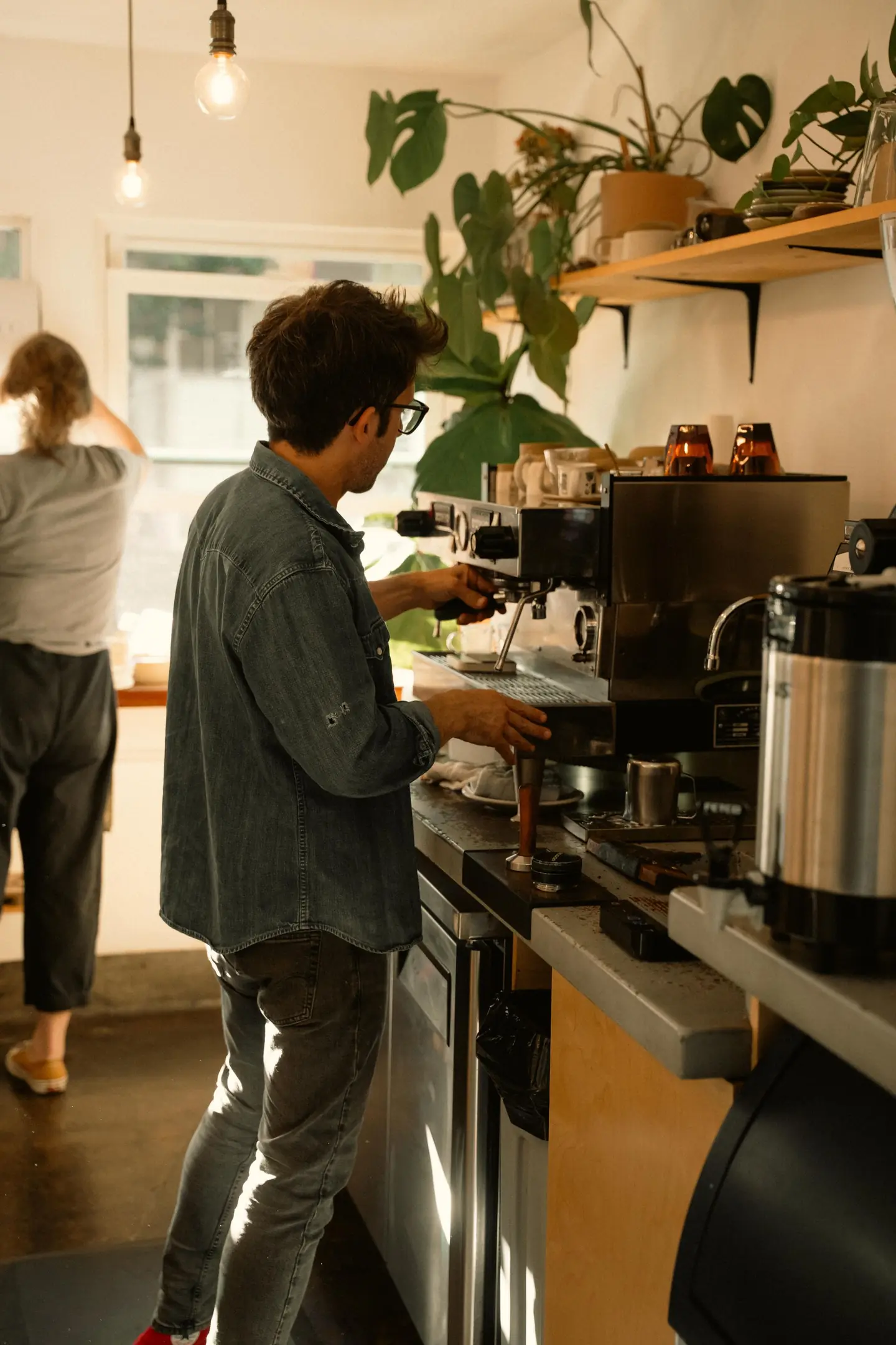 A barista making coffee